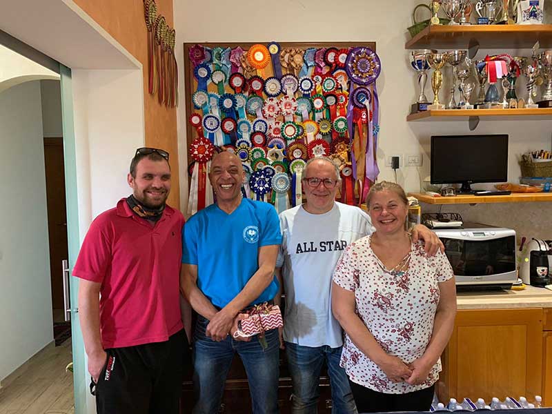 Left to right, couriers Ryan and Shane with Luigi and Gigi. And just look at all those rosettes and cups on the wall behind!