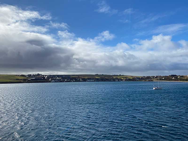 Maine Coon cats: A glorious view as we reached St Margaret's Hope by ferry from the Scottish mainland. Ike and Little Red's new home is in the row of houses on the seafront. So Lis was keeping an eye out, watching for our arrival.