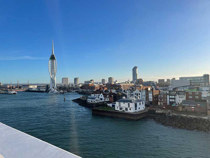 Arrival at Portsmouth International Port. Spinnaker Tower, an observation tower, is part of the harbour redevelopment and one of the tallest accessible structures in the UK outside London.