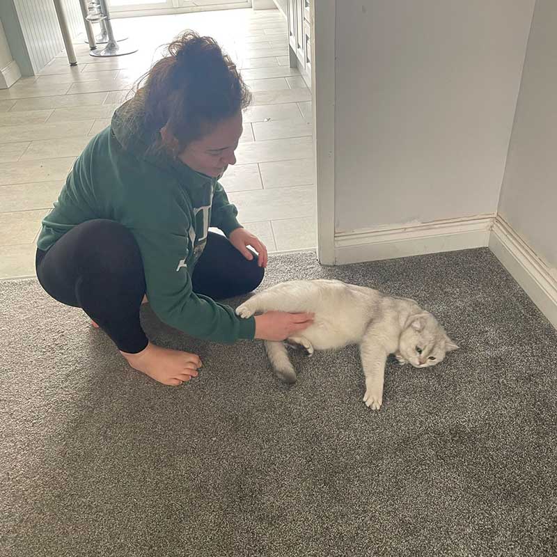 Annabel giving Noodle a reassuring tummy rub