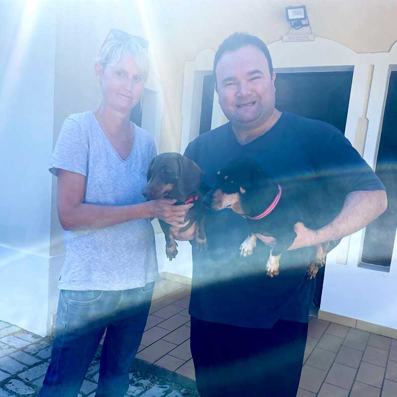 Ian and Jennifer seeing their beloved dogs away in the bright Portuguese sunshine
