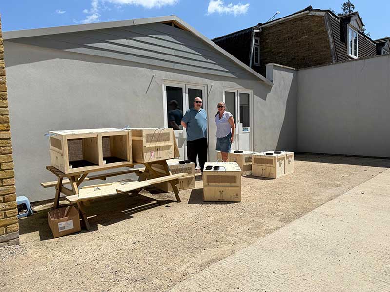 Alan's boxes for the ospreys — flanked by our drivers Matthew and Lisa